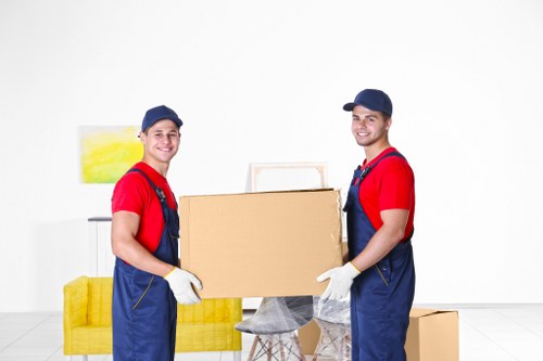 Professional movers unloading items at a Worcester Park property
