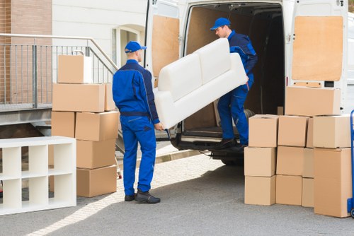 Person using a laptop with accessible moving service information