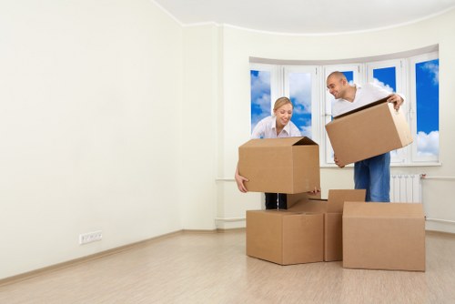 Professional removals crew handling furniture and boxes