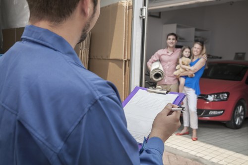 Removal van and moving crew in a Worcester Park residential street