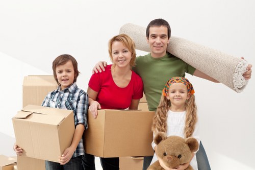 Careful wrapping of fragile household items during packing