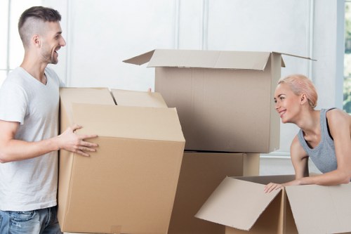 Moving crew carrying furniture from a Worcester Park property