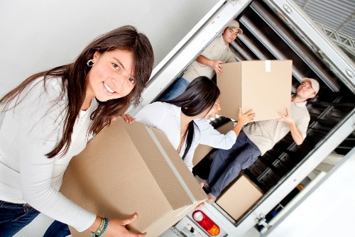 Packed office equipment and furniture ready for transport