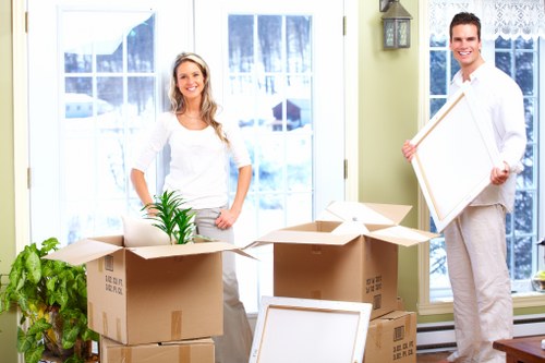 Packed office boxes and dismantled desks ready for relocation