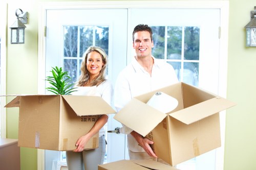 Loading furniture and boxes into a van for a Worcester Park move