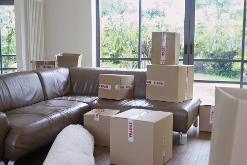 Moving team loading boxes and furniture near a Worcester Park home